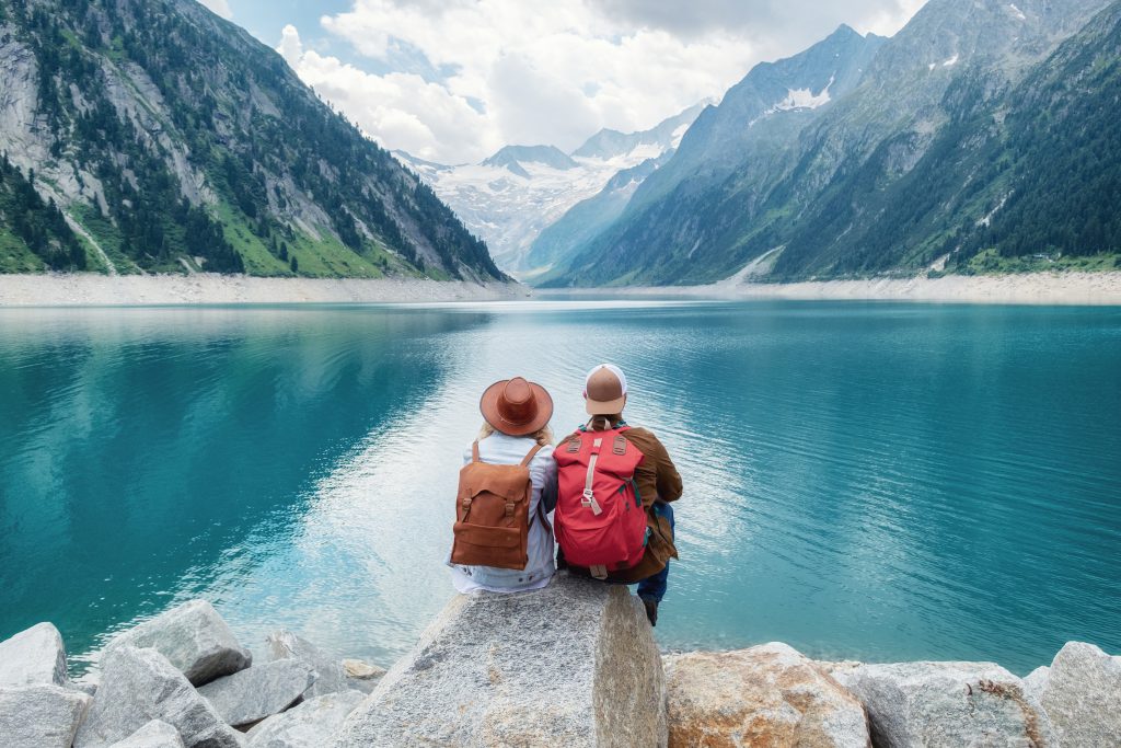 Adventurous Couple Overlooking a Lake